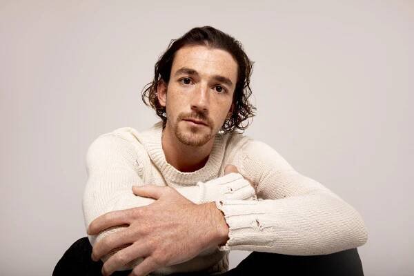 Rory Alexander in a white jumper