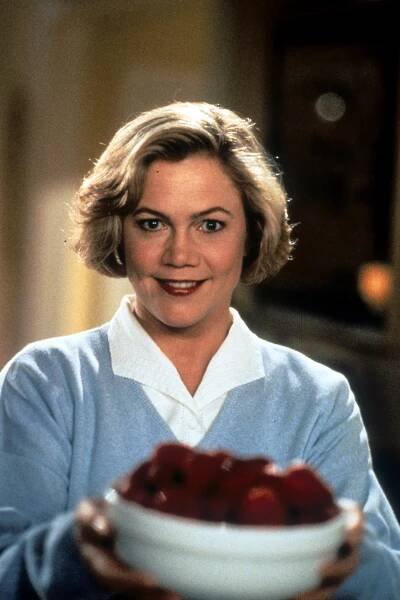 Kathleen Turner holding a bowl of fruit in a scene from the film "Serial Mom," in 1994 | Source: Getty Images