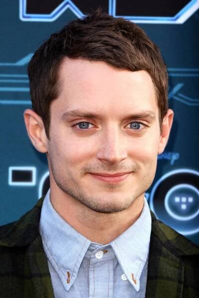 Elijah Wood Looking Stylish in Blue Denim Polo Wallpaper