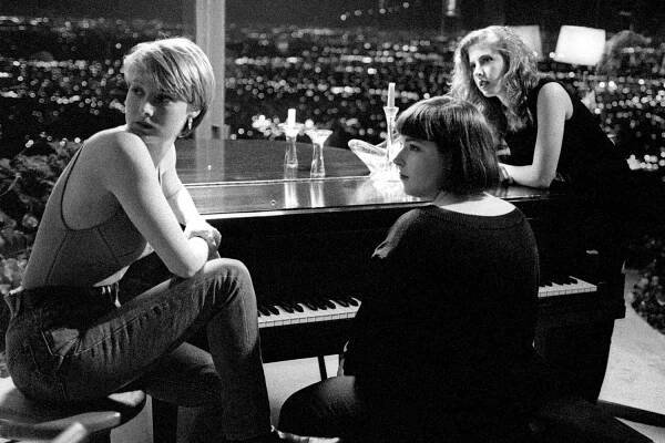 American singer and actress Chynna Phillips, American singer and television personality Carnie Wilson and American singer and television personality Wendy Wilson, of the American pop group Wilson Phillips, sit on the set of their video of "Release Me" 