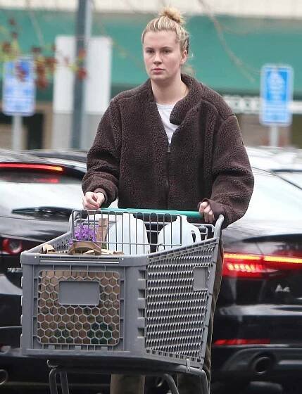 Ireland Baldwin stocks up on groceries at Whole Foods during a break in the rainy weather