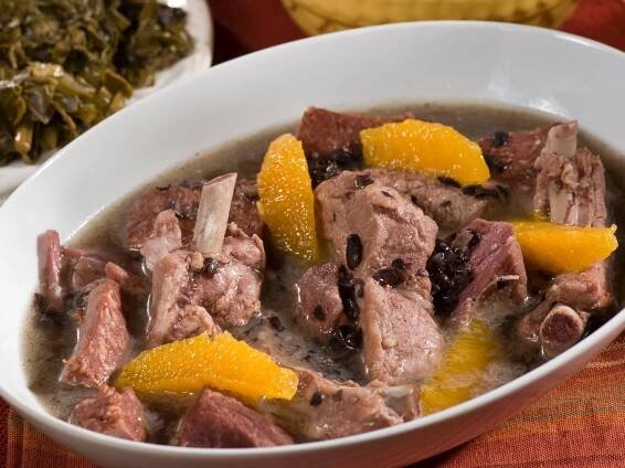 Delicious Brazilian Feijoada stew served in a white bowl Wallpaper