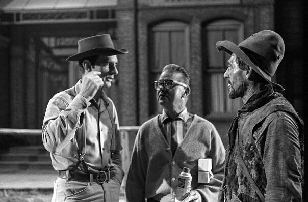 GUNSMOKE, from left: Dennis Weaver, Glen Alden (makeup artist), Ken Curtis, on set, (November 5, 1963), 1955-1975.