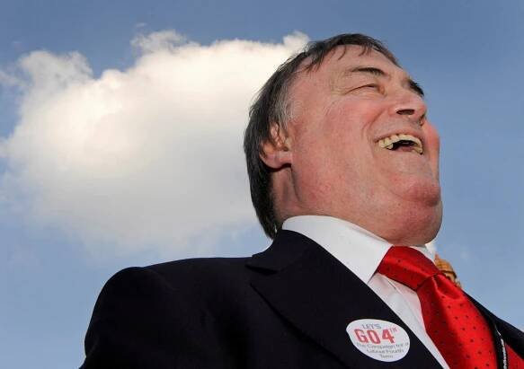 Former deputy Prime Minister John Prescott campaigns outside the entrance to the conference halls during the Labour Party Conference in Manchester northern England