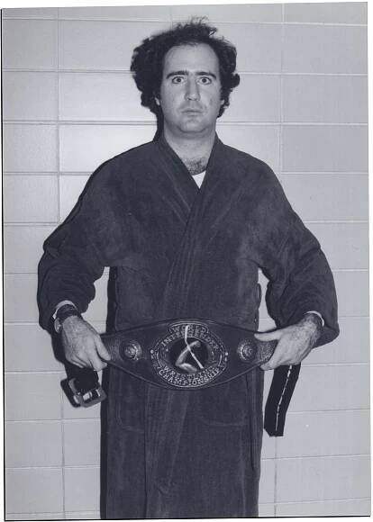Kaufman portrait with wrestling championship belt in black and white film