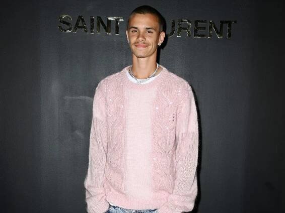 Romeo Beckham just amped up his streetwear collection with a super rare pink hoodie