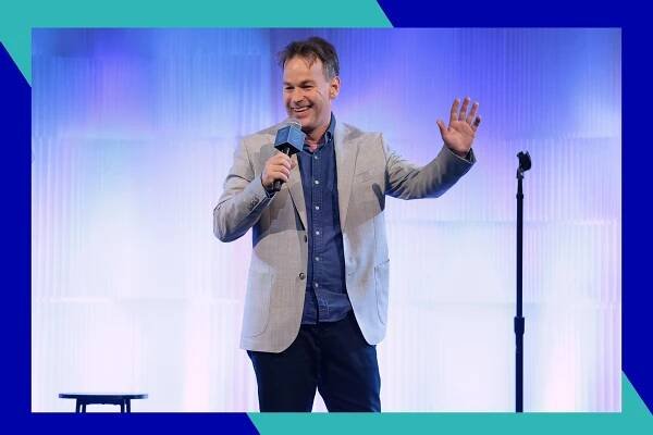 Mike Birbiglia performs onstage.