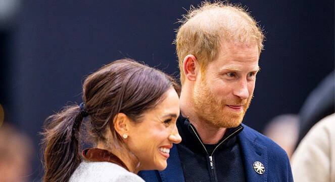 Prince Harry and Meghan Markle smiling