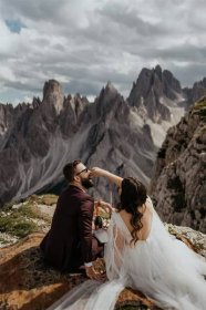 Bride feeding groom during Dolomites intimate vow renewal
