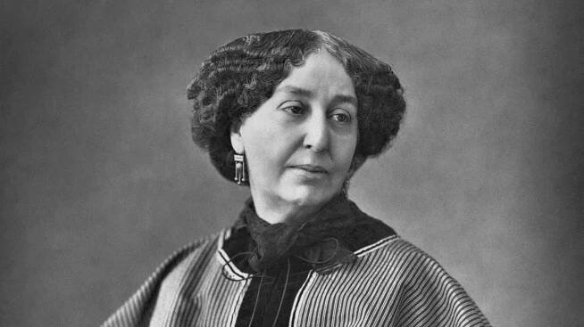 George Sand se oblékala jako muž, kouřila doutníky. Měla milence i milenku, byla neukojitelná