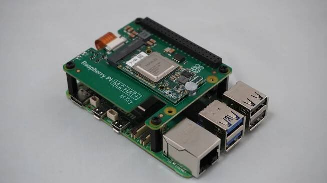 Raspberry Pi AI kit attached to Raspberry Pi 5 with stand-offs and screws