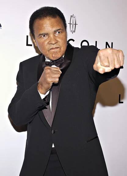 Muhammad Ali (1942—2016) pictured at a black tie event.