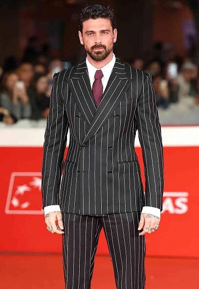Michele Morrone attends the "Modi Three Days On The Wing Of Madness" red carpet during the 19th Rome Film Festival 