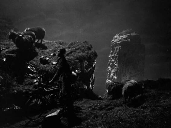 Conrad Veidt with motorcycle near The Old Man of Hoy in The Spy Black (2018)