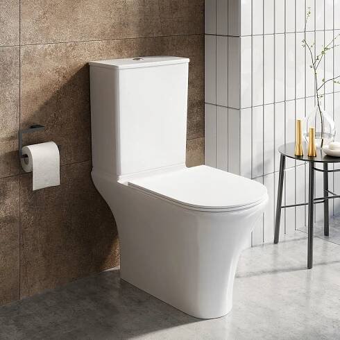 White toilet in stone and marble bathroom