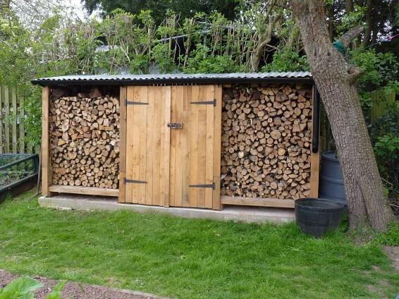 Log store tool shed with double doors (doors made of pallet wood) | Wood shed, Firewood shed, Wood storage sheds