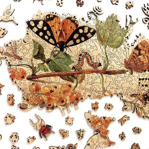 insects and fruits wooden jigsaw puzzle showing a partly completed puzzle and some whimsy pieces