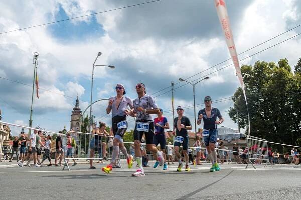 IM 70.3 Hradec Kralove athletes running in the city