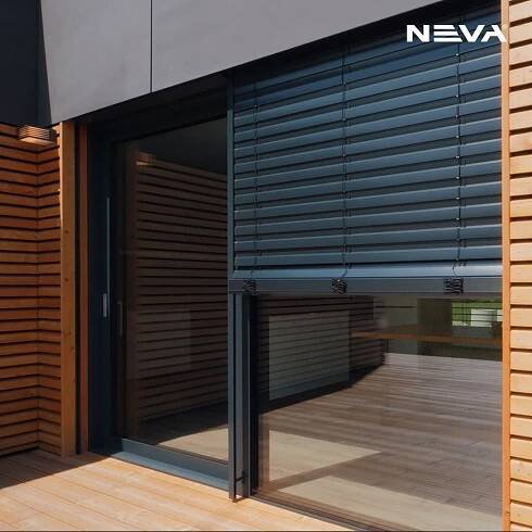 an open window on the outside of a building with wooden slats covering it's windows