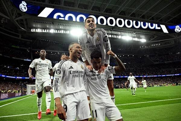 Kylian Mbappé scores hat-trick as Real Madrid thrashes Manchester City to reach Champions League Round of 16