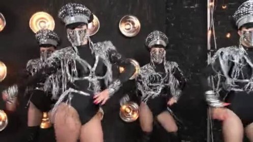 European four girls show teem in costumes masks butt dancing on black background in studio — Stock záběr