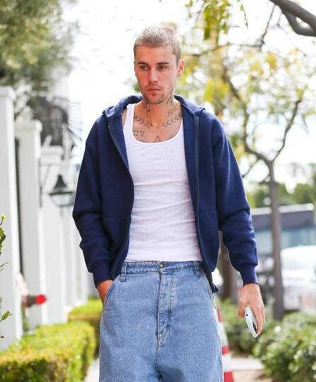 Justin Bieber walking down the street.