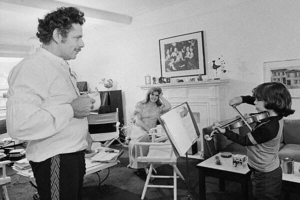 Comedians Jerry Stiller and wife Anne Meara watch their son Ben Stiller practice the violin at the family's Upper West Side, Manhattan apartment on May 29, 1972
