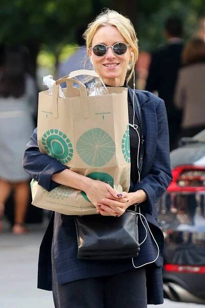 Naomi Watts is all smiles while carrying a bag of groceries in New York City.