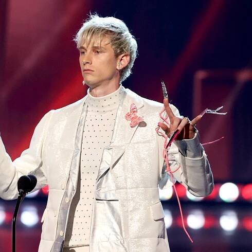 Machine Gun Kelly's Hot Pink and Black Stiletto Nails Are His Longest Manicure Yet — See Photos