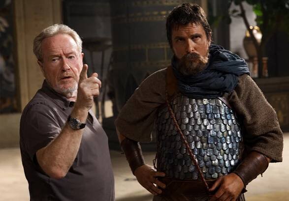 EXODUS: GODS AND KINGS, l-r: director Ridley Scott, Christian Bale on set, 2014. TM and Copyright ©Twentieth Century Fox Film Corporation. All rights reserved.