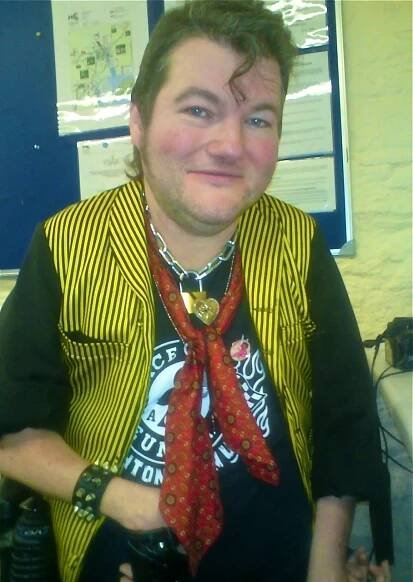 John Kelly of Graeae Theatre, wearing an Ian Dury jacket