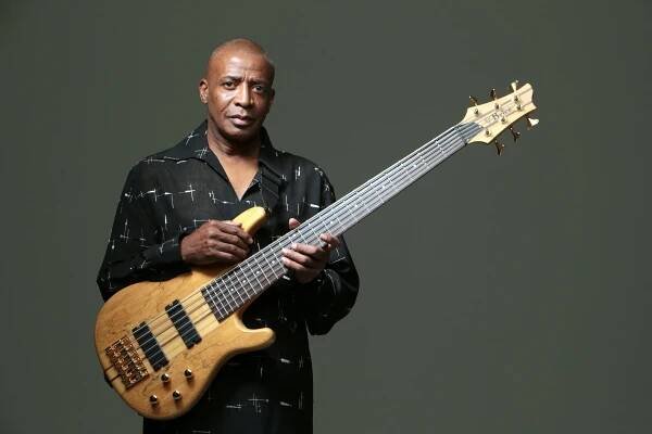 Musican posing with his bass guitar
