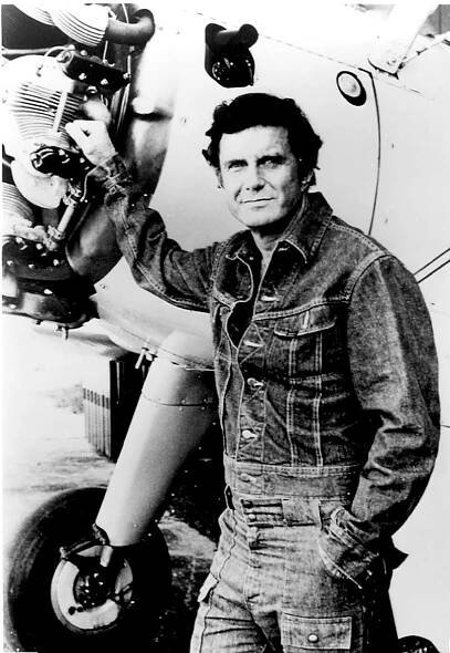 Cliff Robertson in front of a Fairchild PT-19.