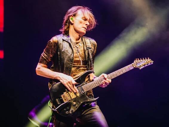 Steve Vai performing on stage