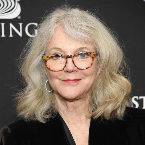 Blythe Danner wears a shoulder-length long bob hairstyle with loose waves