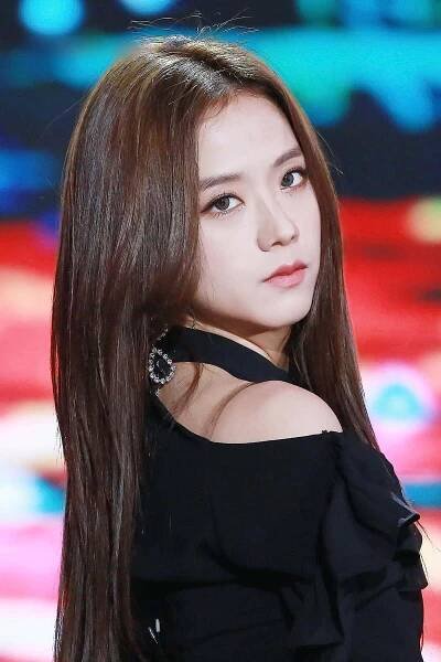 A Young Woman With Long Hair And A Black Dress