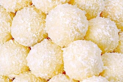 a pile of powdered sugar balls sitting on top of each other