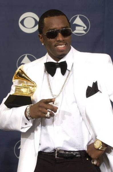 Sean "Diddy" Combs holding a grammy 