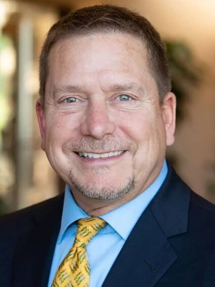 lawyer Conly J Schulte in a suit and tie