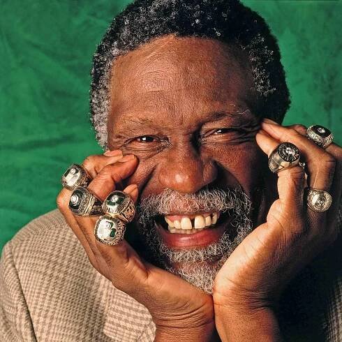 Bill Russell of the Boston Celtics poses for a photo with eleven of his Championship rings in 1996 in Boston, Massachusetts