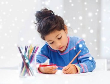 Girl doing homework with colored pencils