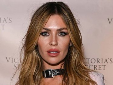 Abbey Clancy puts sky-high legs on full display in tiny denim shorts and daring boots