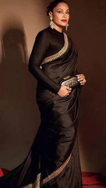 Bipasha Basu captivates in a timeless black satin saree