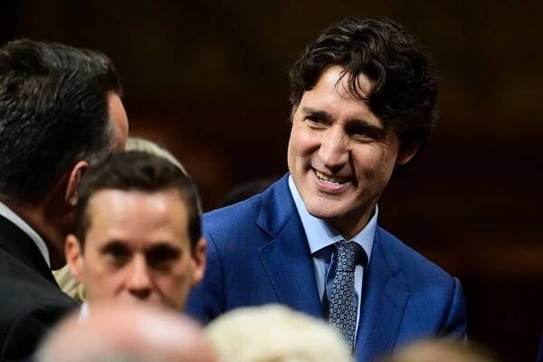 Former Canadian Prime Minister Justin Trudeau (C) greets people before Britain's King Charles III delivers a speech from the Throne to open the first session of the 45th Parliament of Canada at the Senate of Canada, in Ottawa on May 27, 2025. Britain's King Charles III is heading to Canada for a brief but 
