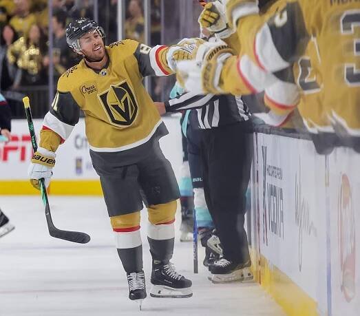 LAS VEGAS, NEVADA - OCTOBER 10: Jonathan Marchessault #81 of the Vegas Golden Knights celebrates with teammates on the bench after scoring a first-period goal against the Seattle Kraken during their game at T-Mobile Arena on October 10, 2023 in Las Vegas, Nevada. The Golden Knights defeated the Kraken 4-1. (Photo by Ethan Miller/Getty Images)