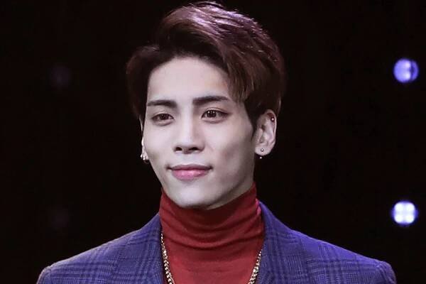 FILE - In this Oct. 4, 2016, file photo, Kim Jong-hyun, a member of South Korean K-pop group SHINee, poses for the media before a showcase for the group's album 