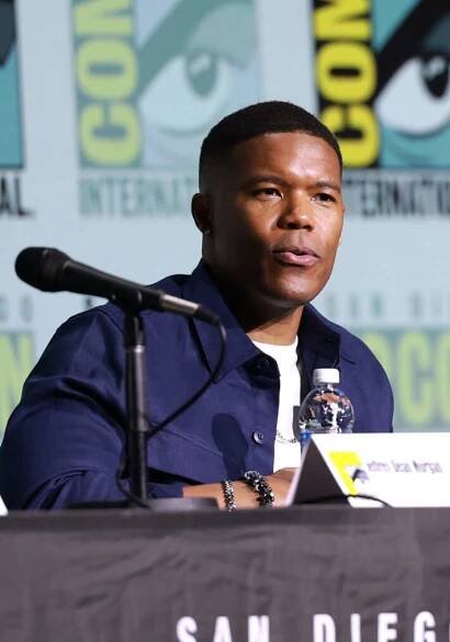 Gaius Charles speaks onstage during 