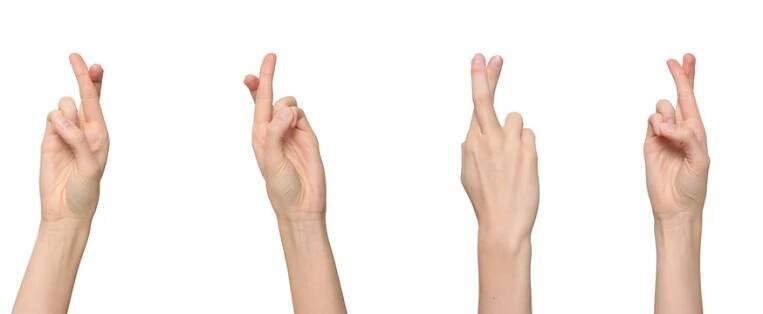 Female fingers crossed, one finger on top of another hoping for good luck, isolated on transparent background, png file