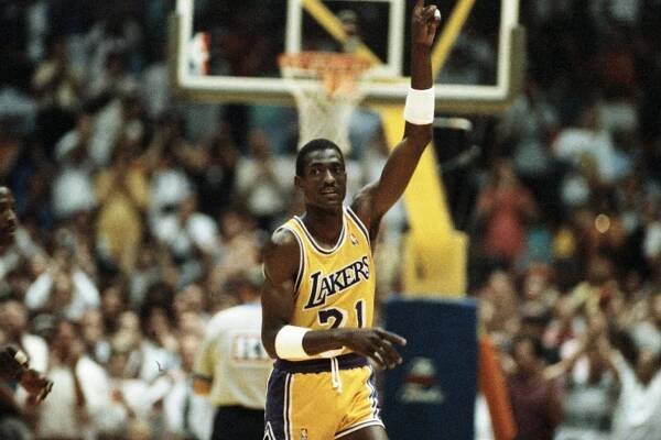 Laker forward Michael Cooper raises his finger to signify the Lakers are #1.