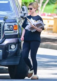 Mia Goth holding mail in Pasadena Thursday